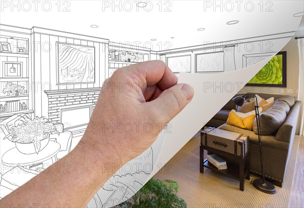 Male hand turning page of custom living room photograph to drawing underneath