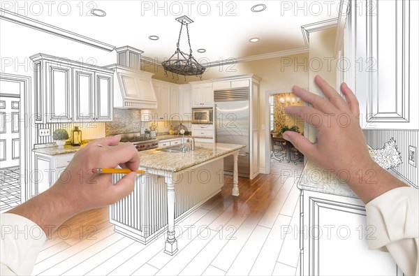 Male hands sketching with pencil A custom kitchen with photo showing through