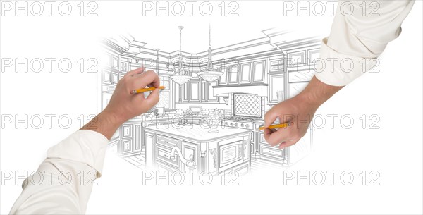 Two male hands sketching with pencil the outline of a beautiful custom kitchen