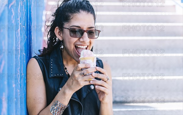 Urban girl eating an ice cream cone