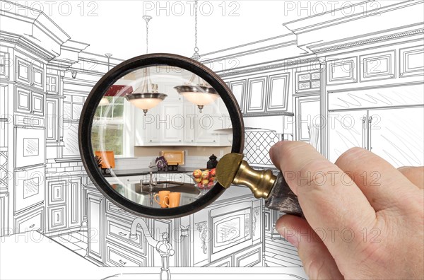 Hand holding magnifying glass revealing custom kitchen design drawing and photo combination