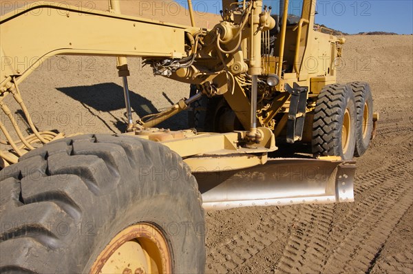 Tractor at a construction site and dirt lot