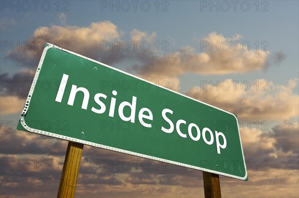 Inside scoop green road sign with dramatic clouds and sky