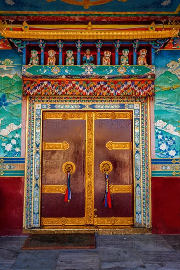 Door gate in Buddhist monastery. Mud village