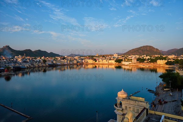 View of famous indian hinduism pilgrimage town sacred holy hindu religious city Pushkar amongst hills with Brahma mandir temple