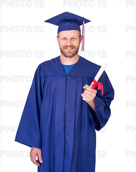 Happy male graduate in cap and gown with diploma isolated on white