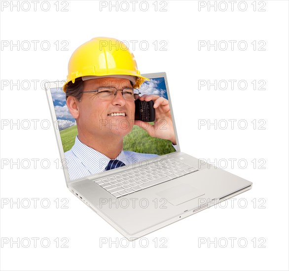 Laptop and man with hard hat on cell phone extruding the screen