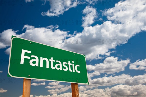 Fantastic green road sign with dramatic clouds and sky