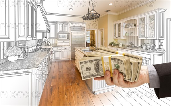 Hand handing stacks of money over custom kitchen design drawing and photo combination