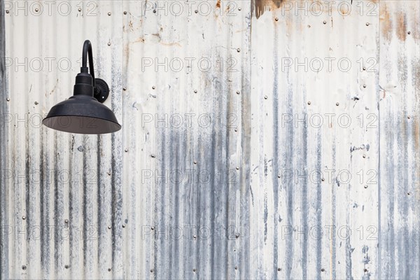 Old rusty sheet metal and lamp abstract background texture