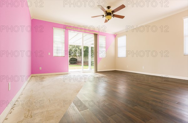 Empty room with cross section showing before and after with new wood floor and paint