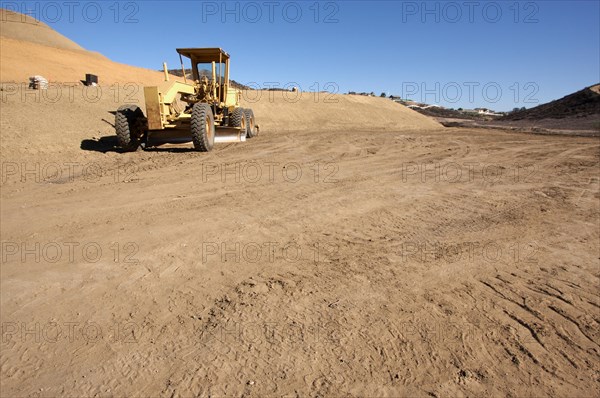 Tractor at a construction site and dirt lot