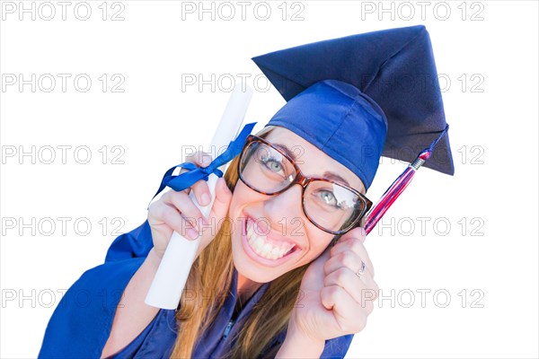 Goofy graduating young girl in cap and gown isolated on a white background