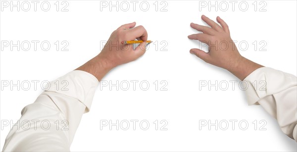 Male hands sketching with pencil on white background