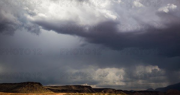 Ominous stormy skies with cumulous clouds and rain