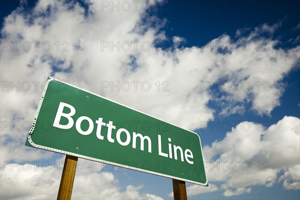 Bottom line road sign with dramatic clouds and sky