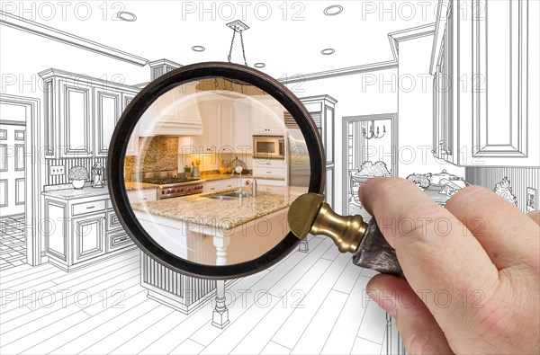 Hand holding magnifying glass revealing custom kitchen design drawing and photo combination