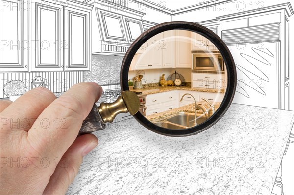 Hand holding magnifying glass revealing custom kitchen design drawing and photo combination