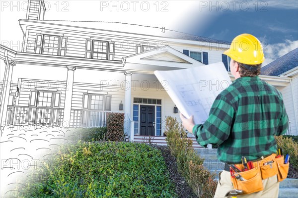 Male contractor with hard hat and tool belt looking at custom house drawing photo combination on white