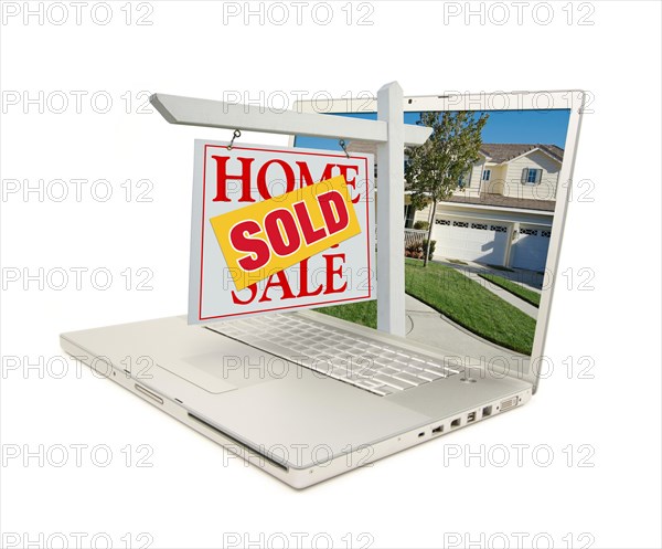 Red sold home for sale sign on laptop isolated on a white background