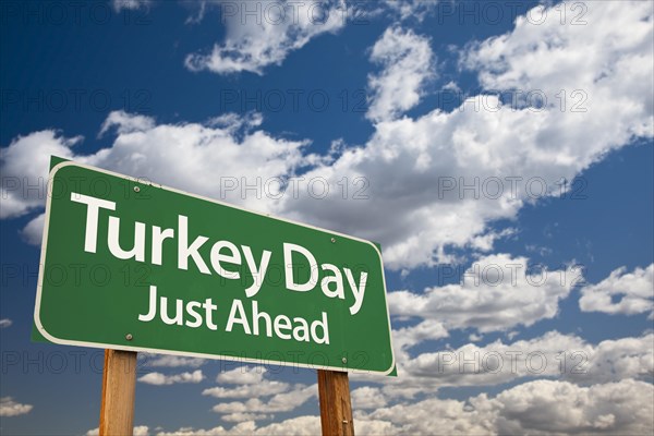 Turkey day green road sign with dramatic clouds and sky