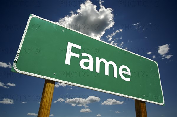 Fame road sign with dramatic clouds and sky