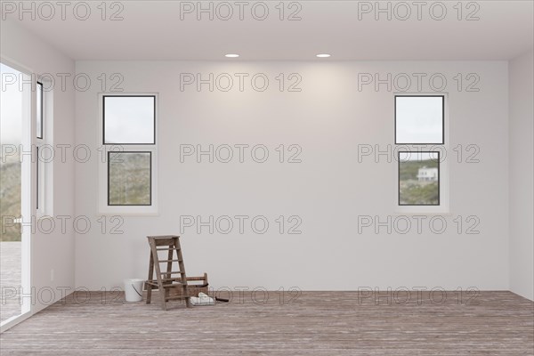 Ladder and painting equipment in raw unfinished room of house with blank white walls and worn wood floors