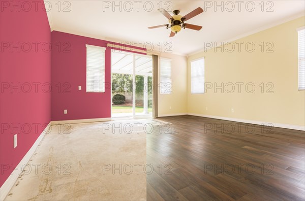 Empty room with cross section showing before and after with new wood floor and paint