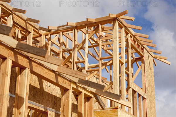 Abstract of wood home framing at construction site