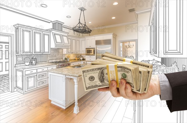 Hand handing stacks of money over custom kitchen design drawing and photo combination