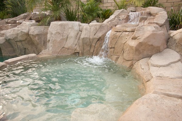 Tropical custom pool with waterfalls