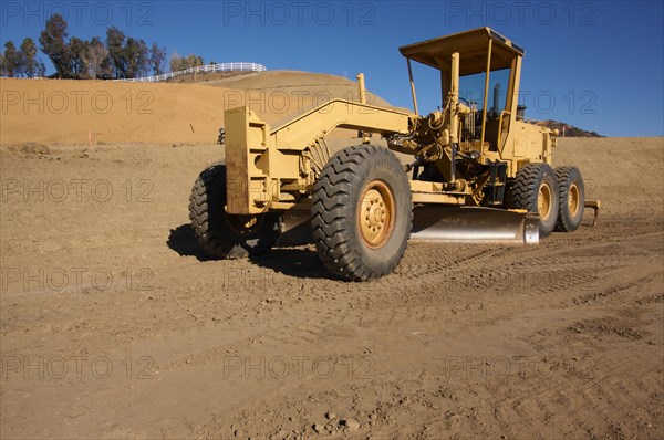 Tractor at a construction site and dirt lot