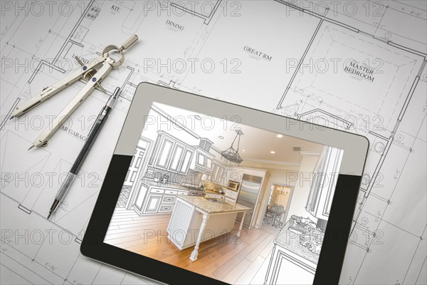 Computer tablet showing kitchen illustration sitting on house plans with pencil and compass