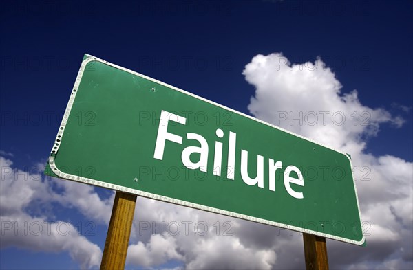 Failure road sign with dramatic clouds and sky