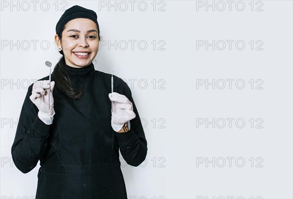 Portrait of a dentist with dental tools