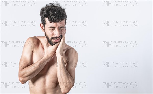 Man with earache on isolated background