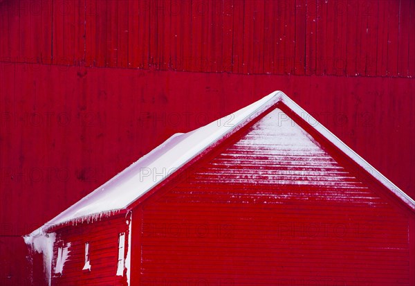 A red barn with snow in Vermont