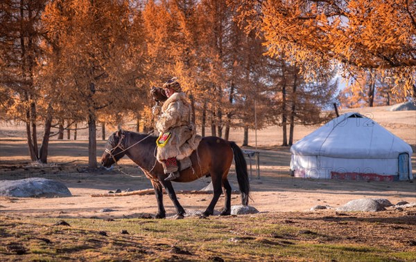 Go hunting with his eagle. Western Mongolia