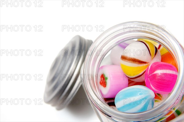 Various candies inside a glass jar