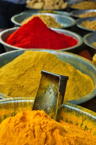 Turmeric curcuma powder and chili powder in spices market in India. Sardar Market