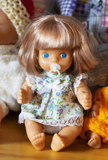 Portrait of an old decorative baby doll