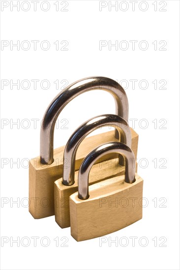 Three padlocks of different size isolated on white