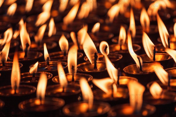 Burning candles in Buddhist temple Dharamsala