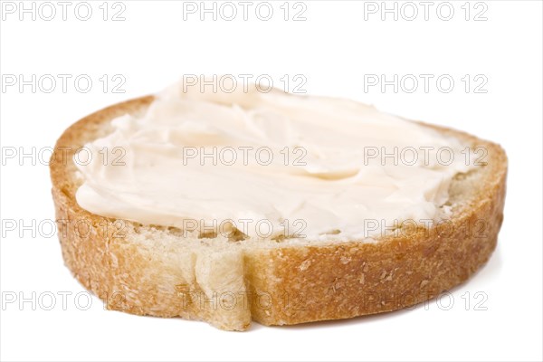 Slice of bread with cheese cream spread on it