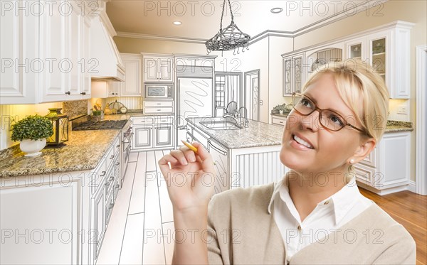 Creative woman with pencil over custom kitchen design drawing and photo combination