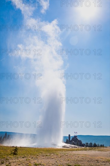 Old faithful geyser erupting at yellowstone national park