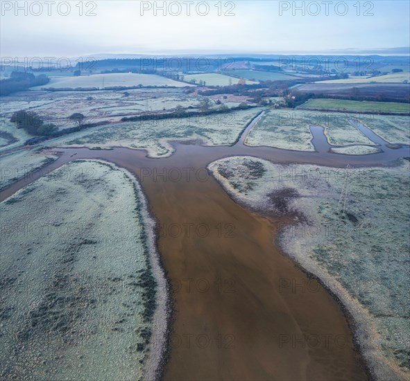 RSPB Exminster and Powderham Marshes and River Exe from a drone at sunrise