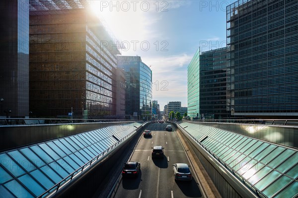 Street traffic in Brussels near European Commission building on sunset Rue de la Loi