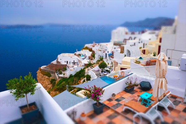 Famous greek iconic selfie spot tourist destination Oia village with traditional white houses and windmills in Santorini island