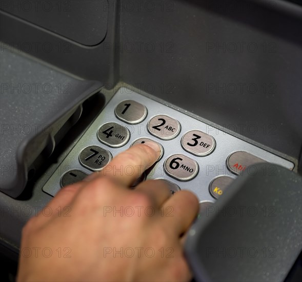 Hand at an ATM